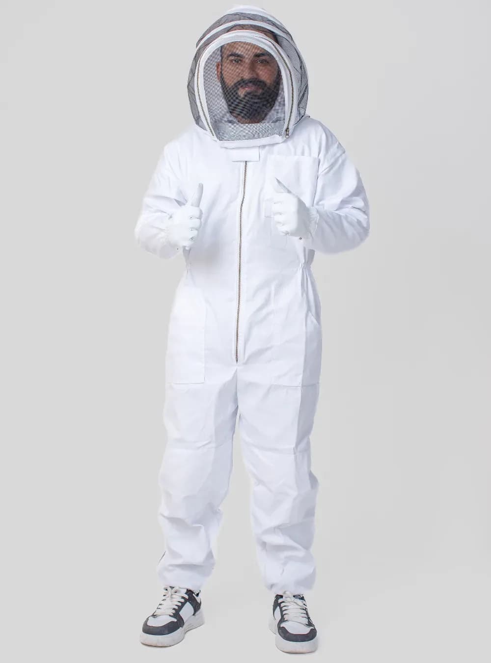 Beekeeper in a white suit wearing an attached fencing veil, compared with a round veil in this guide