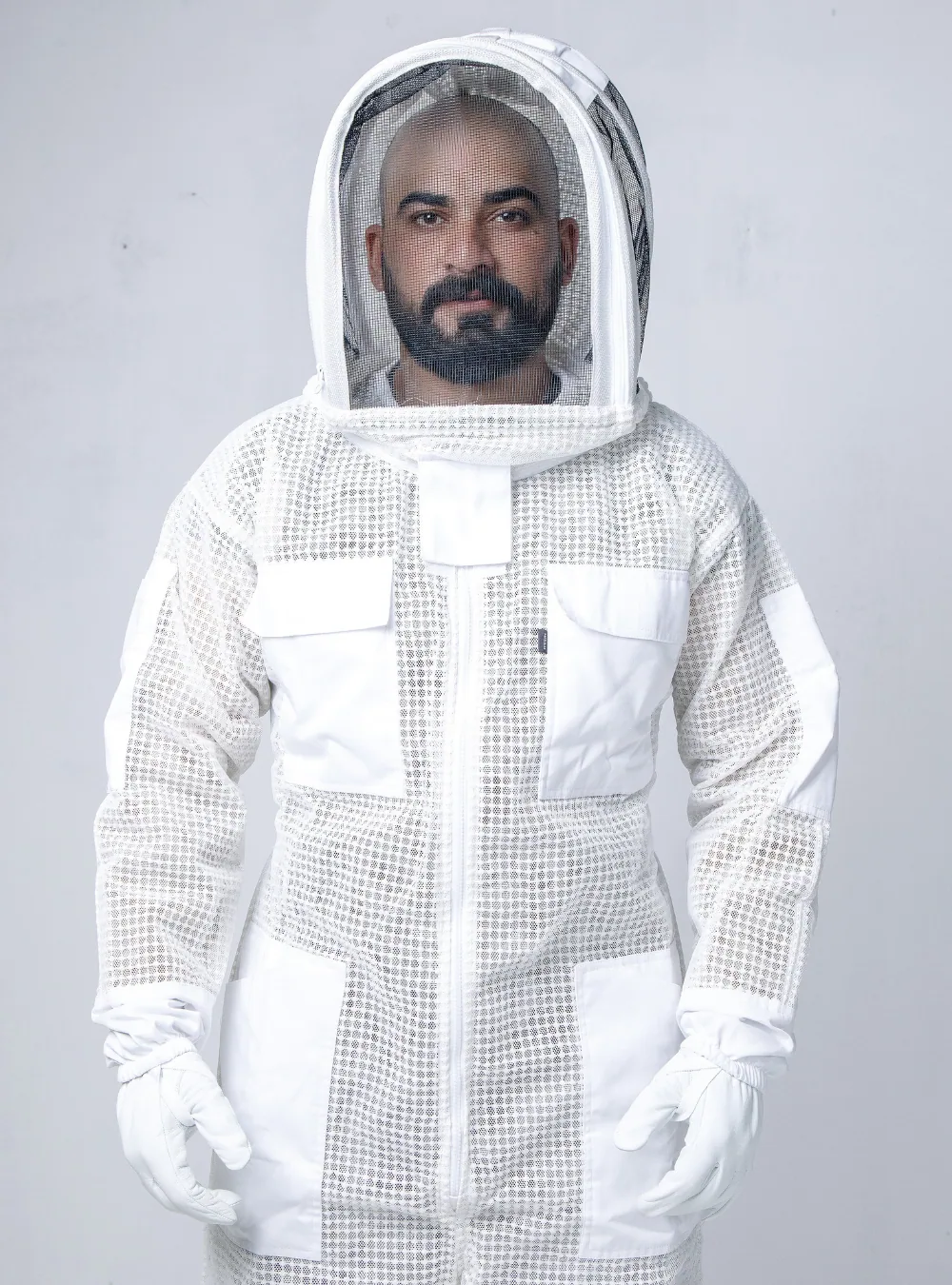 A bee suit for bee removal needs three-layer ventilated construction, because standoff is what survives being pressed against a joist